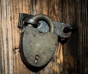 padlock on wooden backdrop