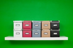 decorative storage boxes on wall shelf