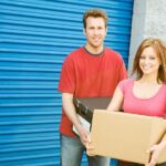 couple in front of storage unit