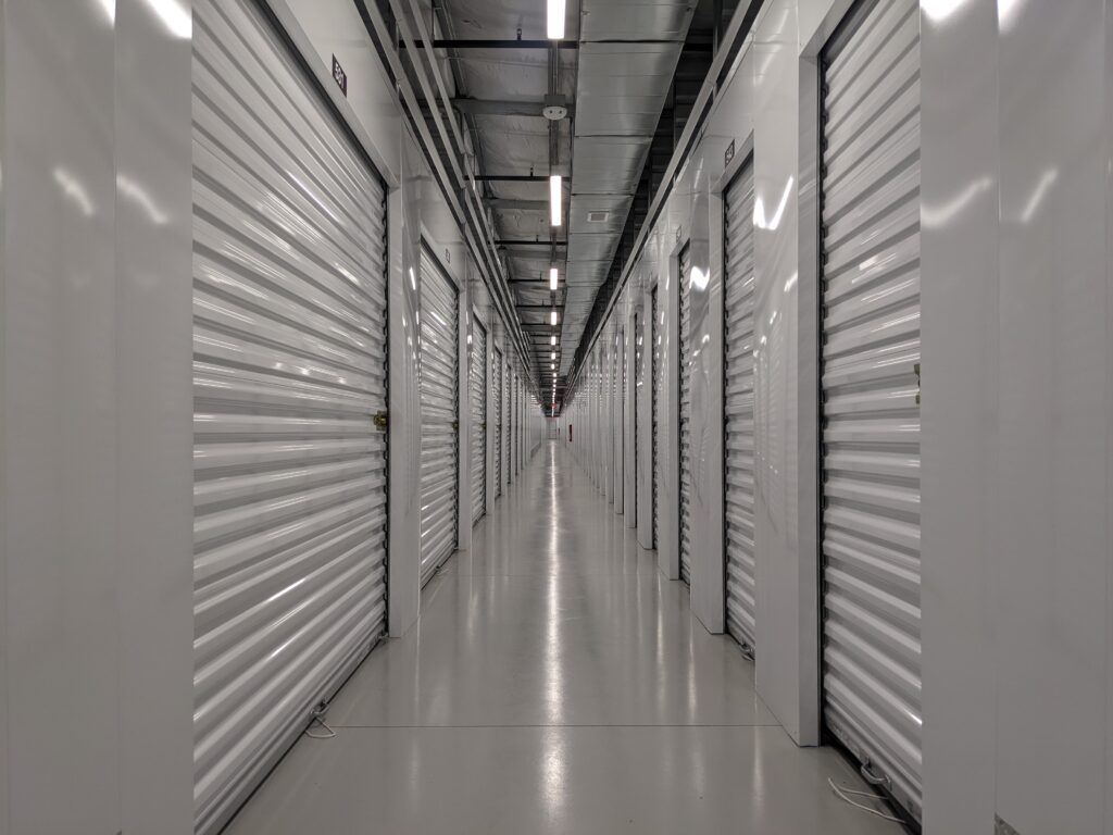An aisle of new indoor storage units at River Crossing Avondale Storage & RV