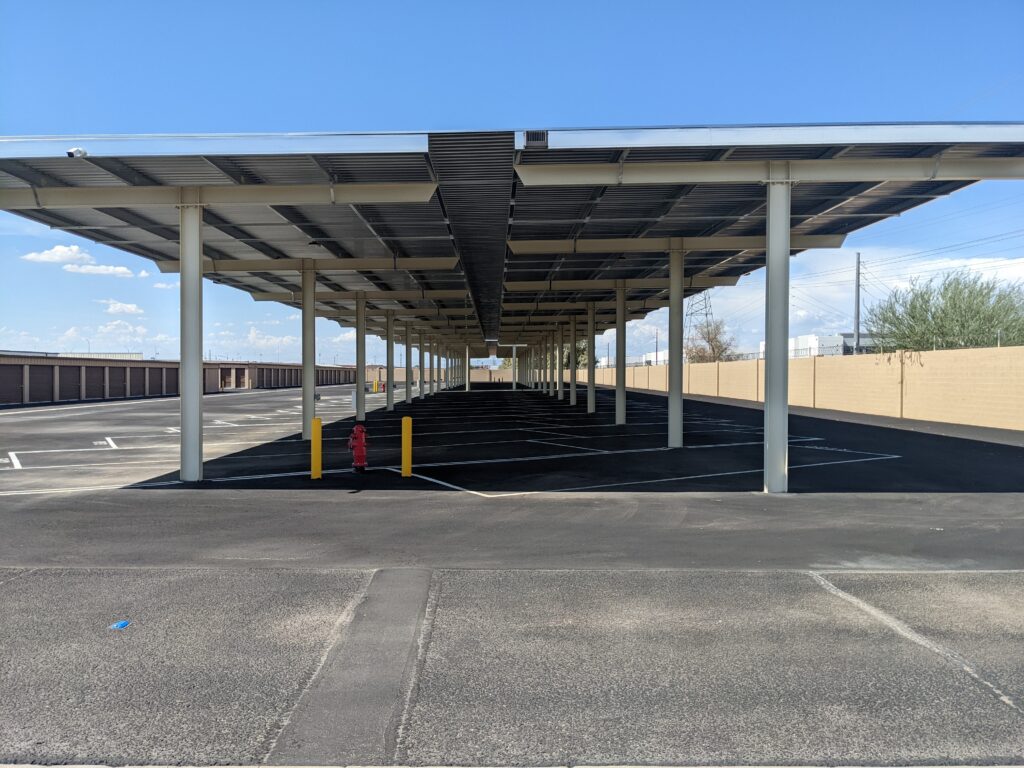 A row of covered parking spaces at River Crossing Avondale Storage & RV