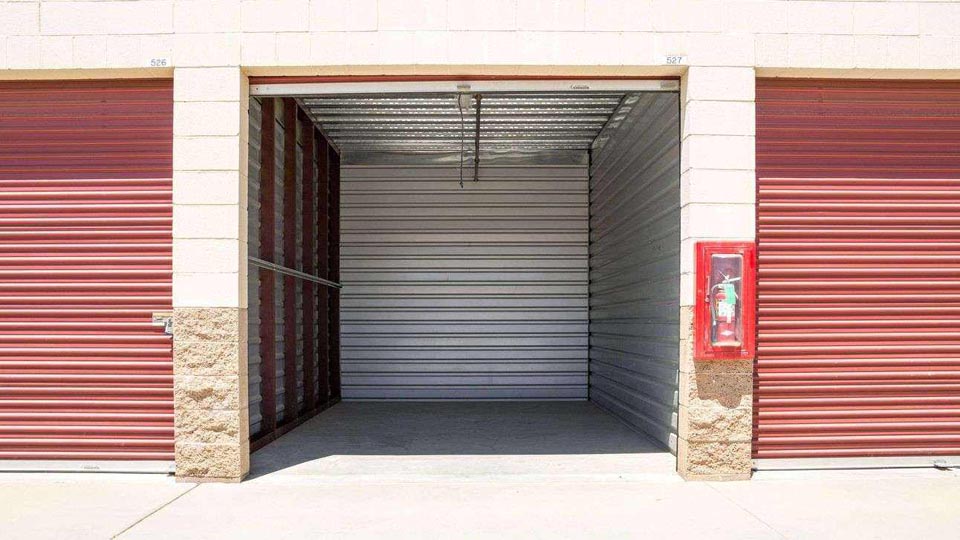 Inside look into a clean outdoor storage unit that is empty