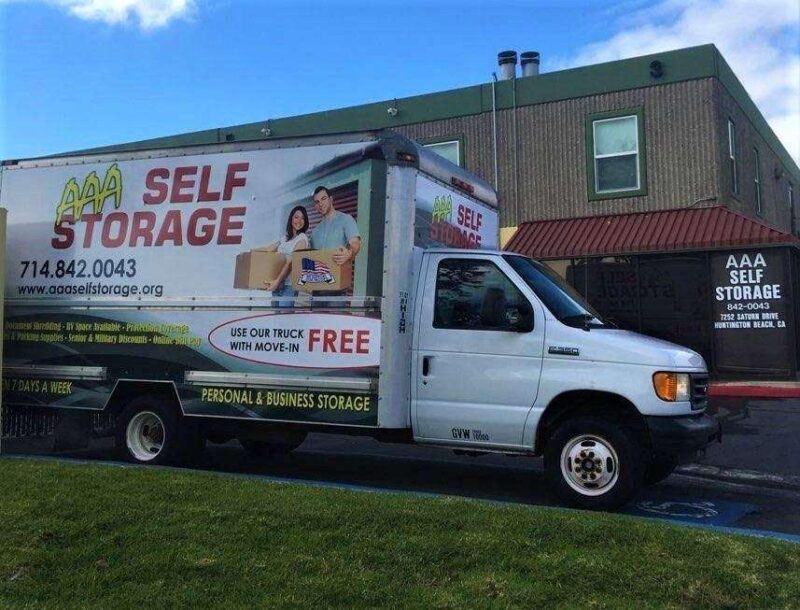 An AAA Self Storage moving truck parked outside of AA Self Storage facility