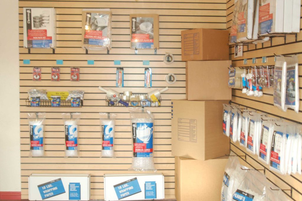 Moving and packing supplies displayed on a wall that are for sale
