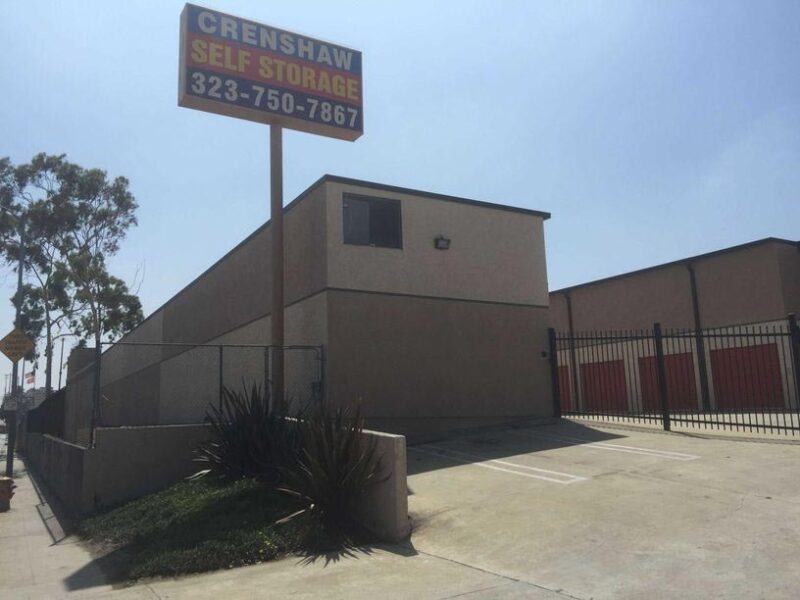 Street entrance to Crenshaw Self Storage facility with a gated entrance