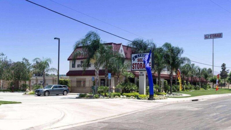 Street entrance to E Street Self Storage facility with a parking lot