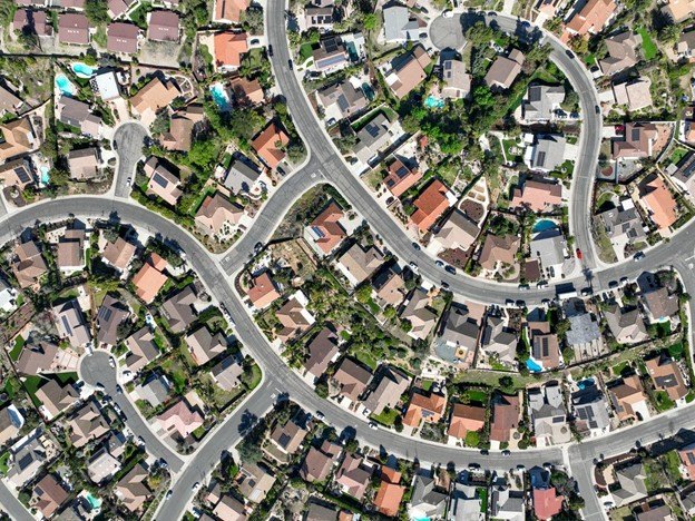 A drone overhead shot of a suburban neighborhood