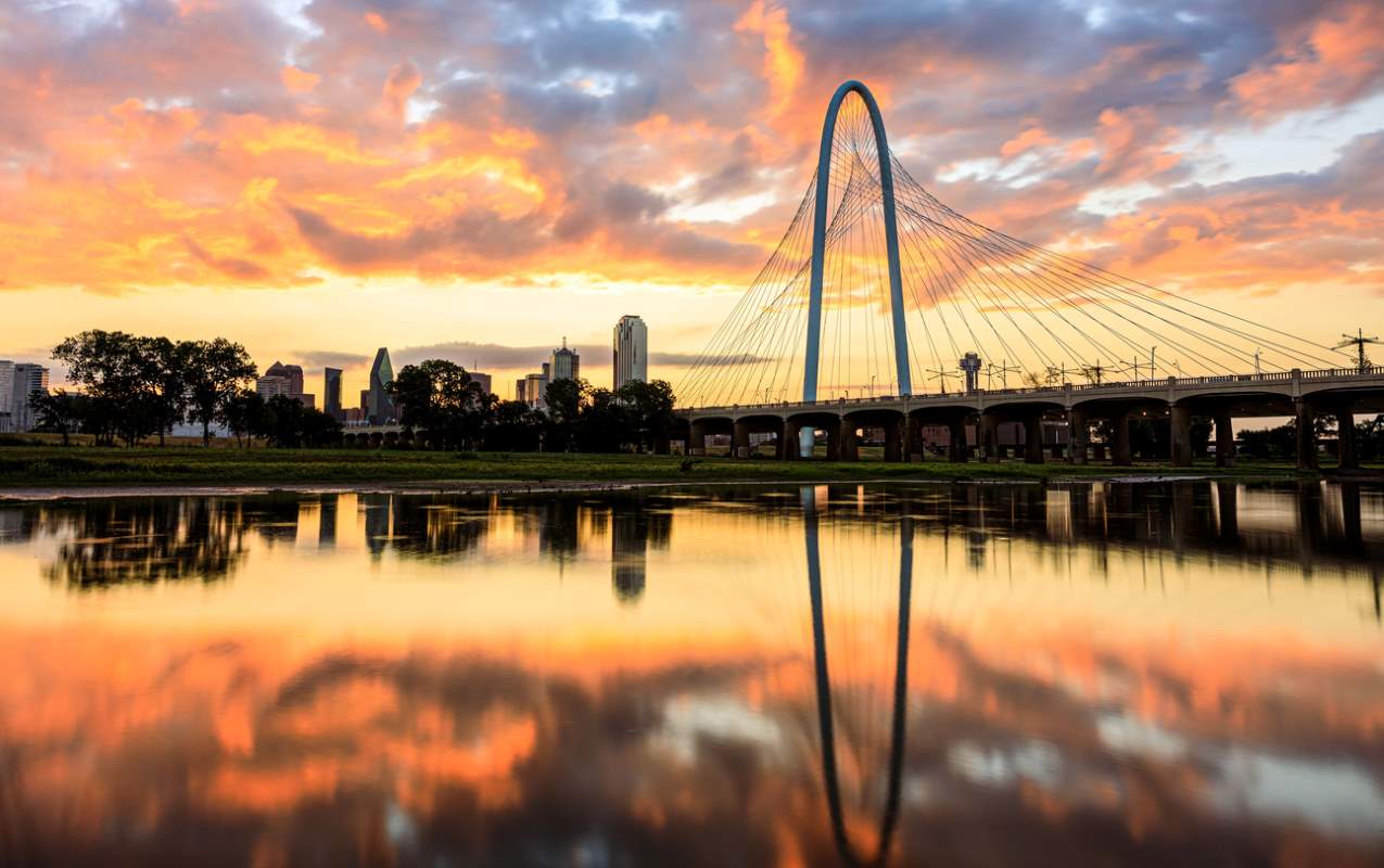 Beautiful sunrise against Dallas, TX, skyline and river.