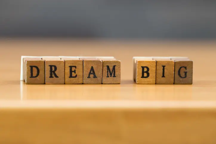 A group of blocks that spell “Dream big.”