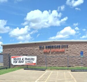 all american brick building with sign